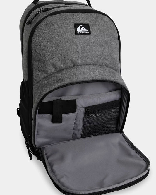 Gray backpack with a visible brand logo on a light gray background