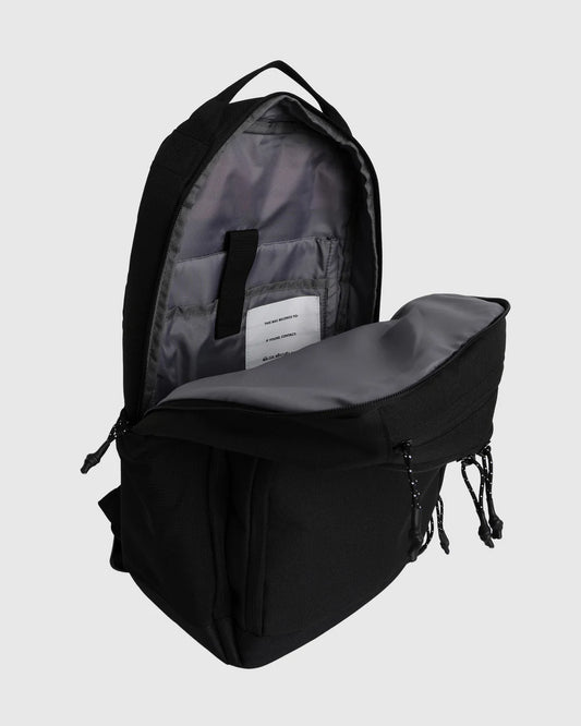 Black backpack with open front compartment on a light gray background