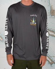 Person wearing a Salty Crew long-sleeve shirt on a background