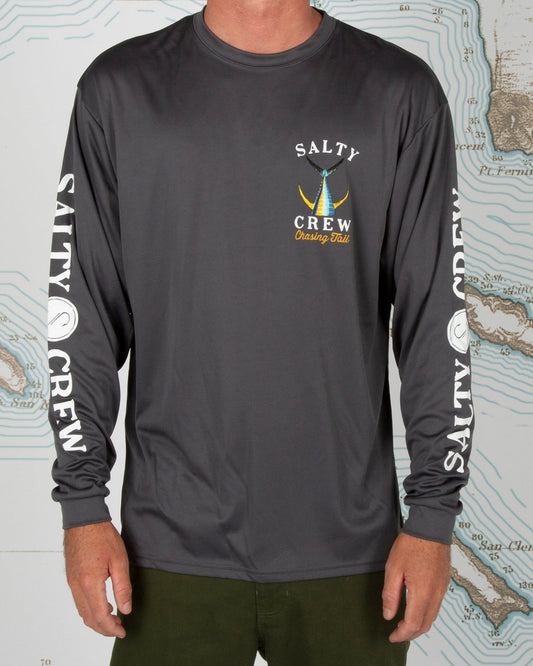 Person wearing a Salty Crew long-sleeve shirt on a background