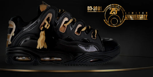 Black sneakers with gold accents on a dark background, featuring a '20th Anniversary' logo.