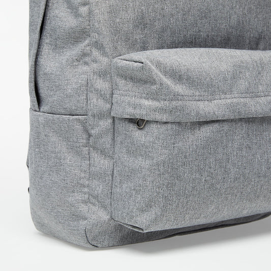 Close-up of a gray backpack corner on a white background