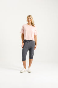 Woman wearing Home-Lee 3/4 Apartment Pants in Graphite and Pink X with White Background