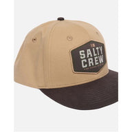 Tan and black cap with Salty Crew logo on a white background