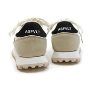 Beige sneakers with black soles and 'ASFVLT' branding on a white background