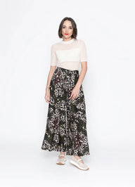 Woman wearing White mesh top with Leopard print pants with white background