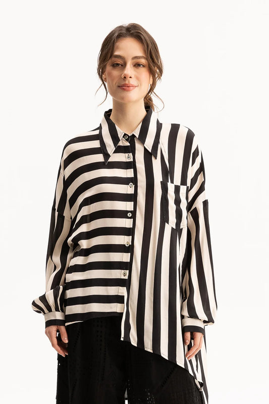 Woman wearing a black and white striped shirt on a white background