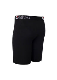 Black athletic compression shorts with a wide waistband featuring the white and red 'ethika' logo, shown on a plain white background.
