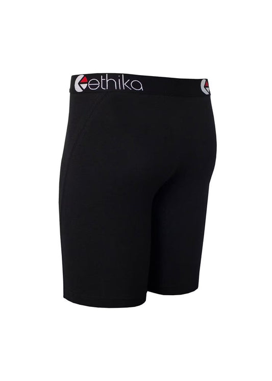 Black athletic compression shorts with a wide waistband featuring the white and red 'ethika' logo, shown on a plain white background.