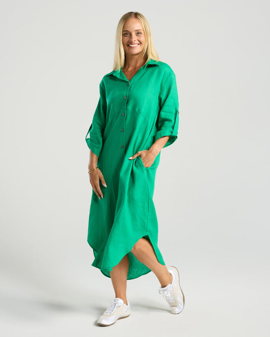 Woman wearing a green dress on a white background