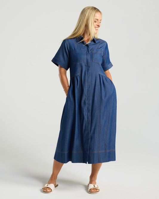 Woman wearing a blue dress on a white background