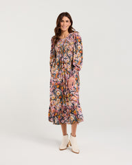 Woman wearing a floral dress on a white background