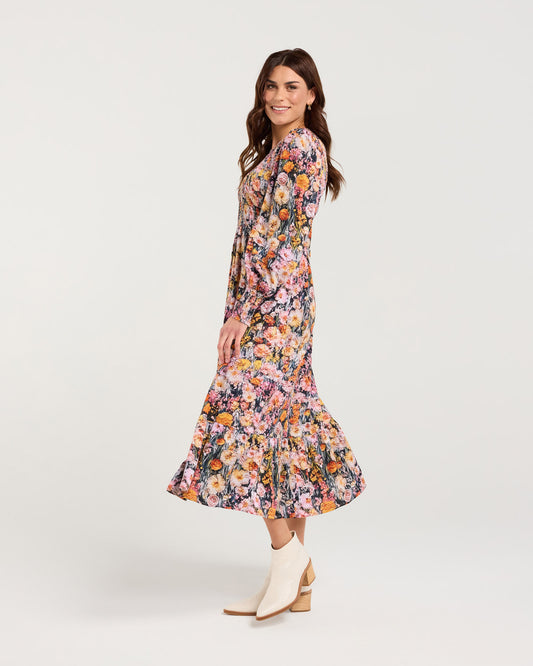 Woman wearing a floral dress on a white background
