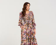 Woman wearing a floral dress on a white background