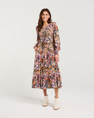 Woman wearing a floral dress on a white background