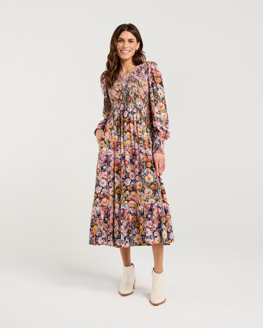 Woman wearing a floral dress on a white background