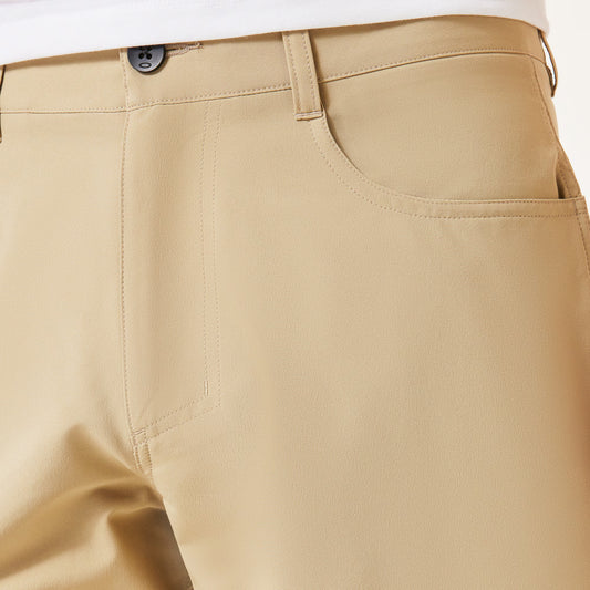 Close-up of beige pants on a white background