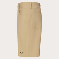 Beige shorts with a brand logo on a light gray background