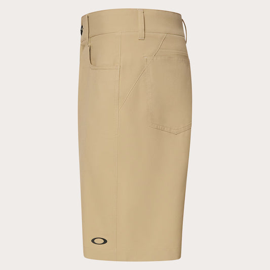 Beige shorts with a brand logo on a light gray background