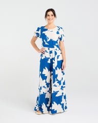Lady wearing Blackstone Juliana Tie Waist Jumpsuit with white background