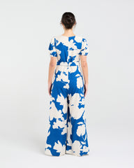 Lady wearing Blackstone Juliana Tie Waist Jumpsuit with white background
