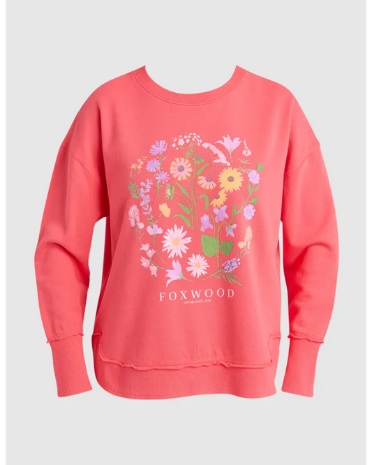 Coral sweatshirt with floral design and 'FOXWOOD' branding on a light gray background