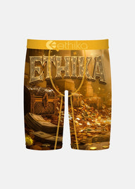 Gold shorts with 'Ethika' branding and treasure chest design on a white background