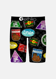 Black shorts with colorful 'Ethika' logo patterns on a white background