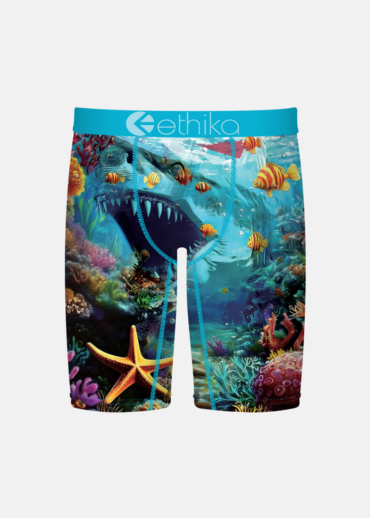 Colorful swim shorts with an underwater scene design on a white background