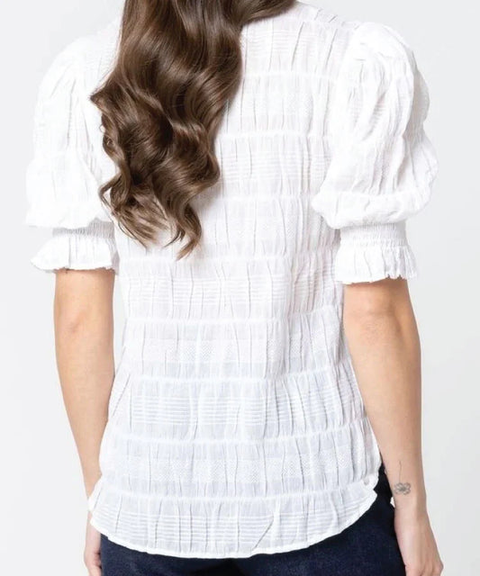 Lady in Seeking Lola Butterfly top in White with white background