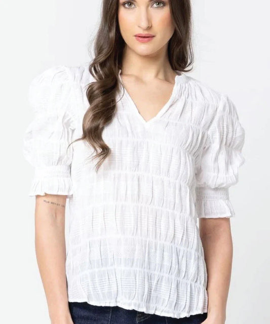Lady in Seeking Lola Butterfly top in White with white background
