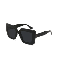Black oversized square sunglasses with thick frames and dark lenses, shown at a three-quarter angle on a plain white background.