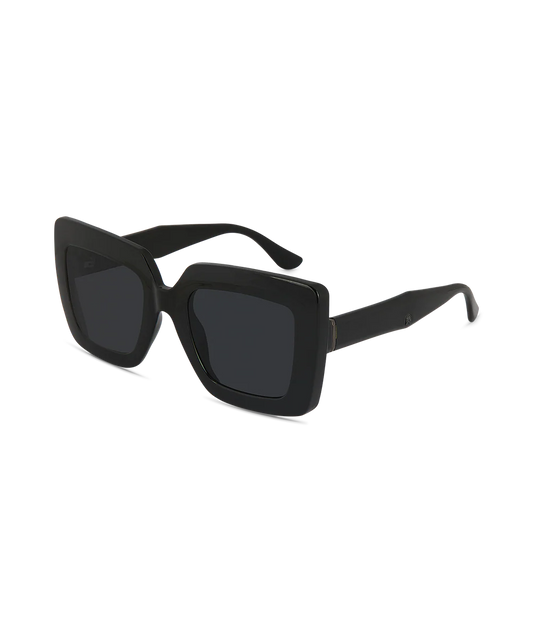 Black oversized square sunglasses with thick frames and dark lenses, shown at a three-quarter angle on a plain white background.