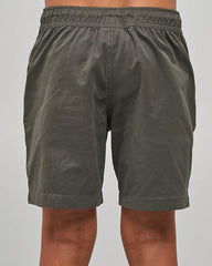 Charcoal shorts worn by a person on a gray background