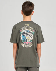 Child wearing a graphic t-shirt and shorts, standing against a plain background