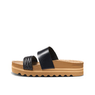 Black sandal with a brown sole on a white background