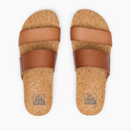 Pair of cork sandals with brown straps on a white background