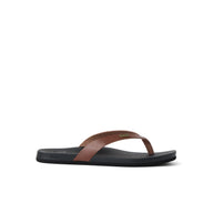 Brown and black sandal on a white background