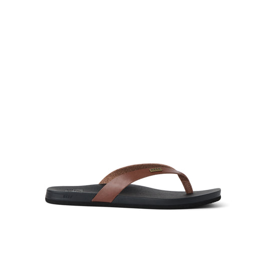 Brown and black sandal on a white background