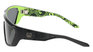 Sunglasses with green and black patterned arms on a white background