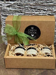 Gift box with jars of honey and a green ribbon, featuring the 'Crafty Chook' brand.