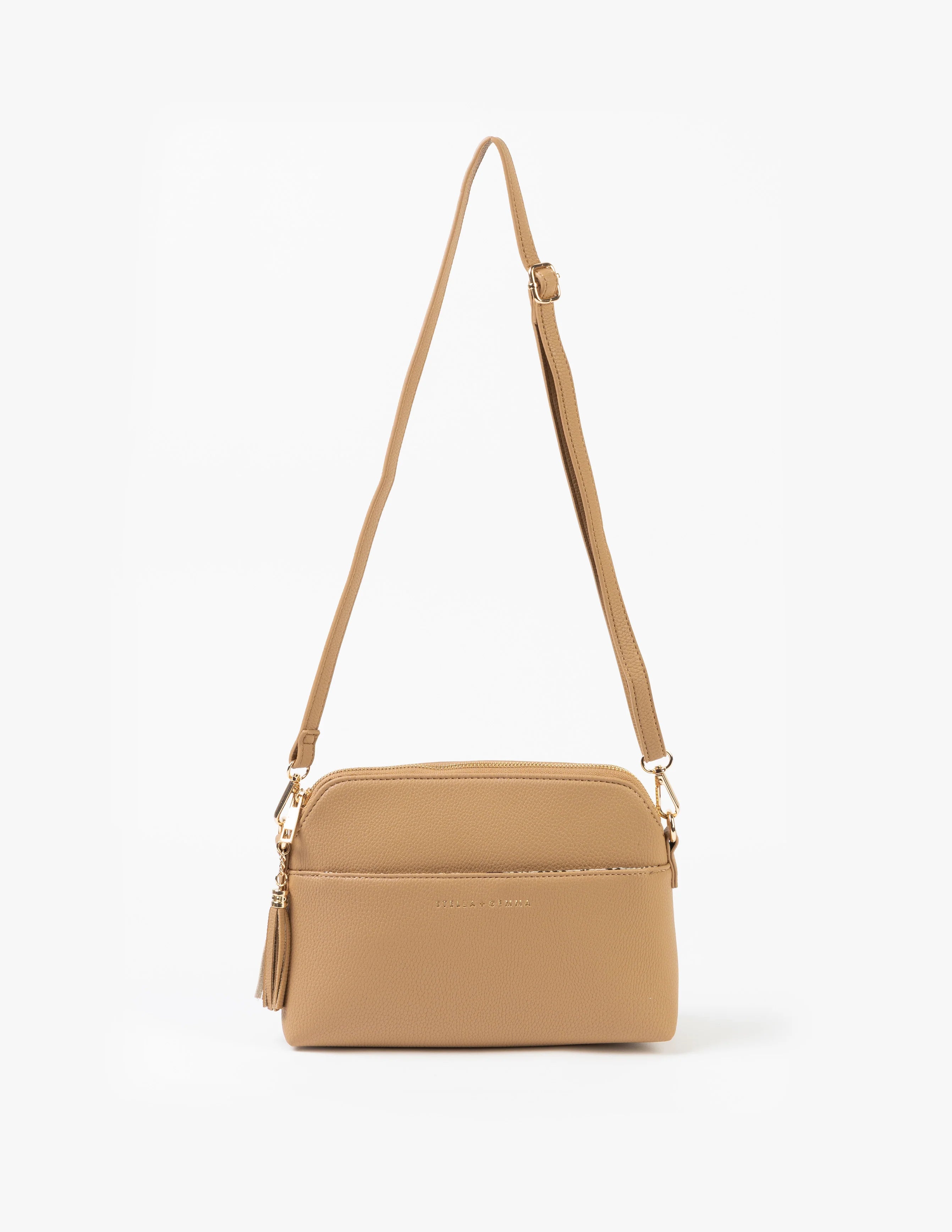 Tan crossbody bag on a white background