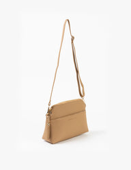 Tan crossbody bag on a white background
