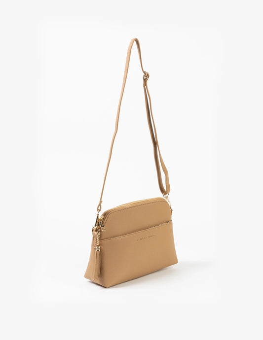 Tan crossbody bag on a white background