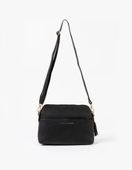 Black handbag with a strap on a white background