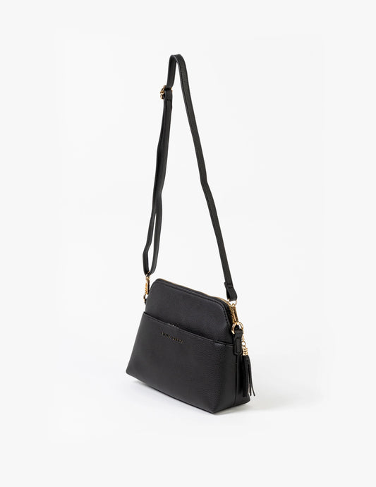 Black handbag with a strap on a white background