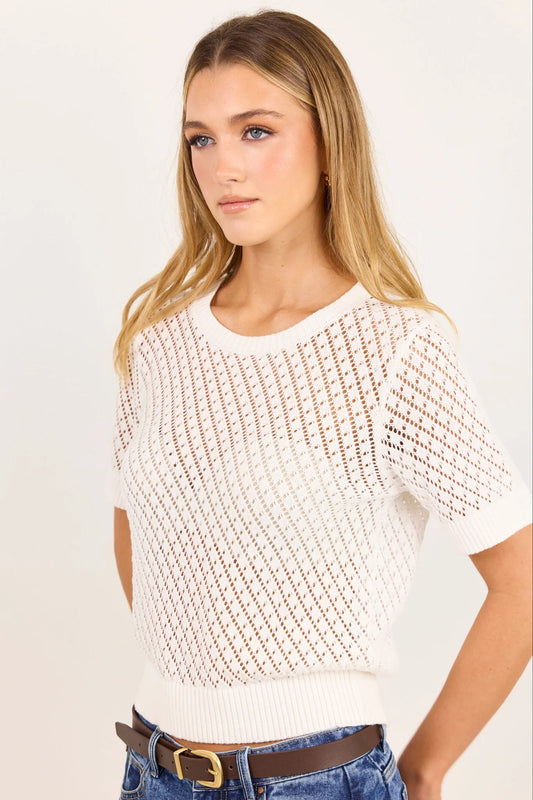 short-sleeve cream-colored knit sweater