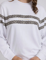 White sweatshirt with leopard print stripes and 'Stella & Gemma' logo.