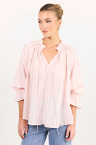 Blush pink top on model 