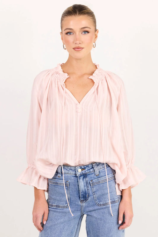 Blush pink top on model 